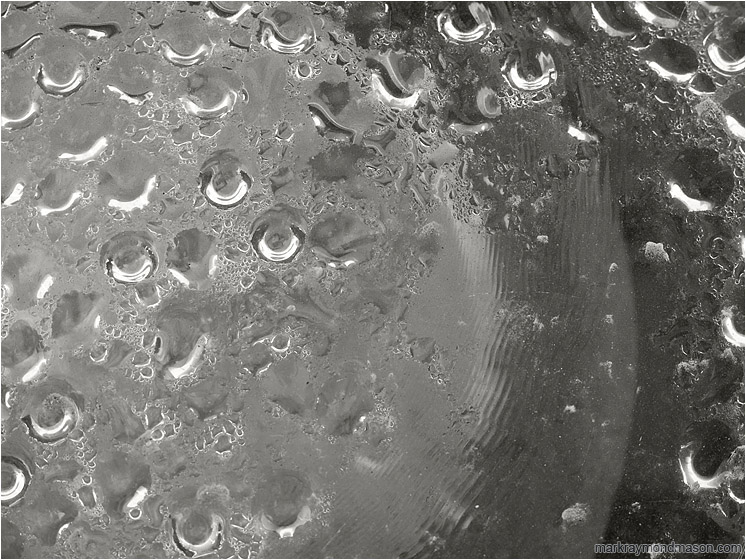 Floodlamp, Condensation (B&W): Las Vegas, NV, USA (2012-01-06) - Abstract black and white photograph of beads of water on the inside of a streetlamp bulb
