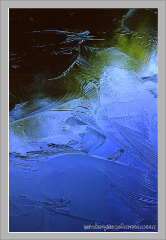 Fine art abstract photograph of colors, shapes and reflections in a frozen lake