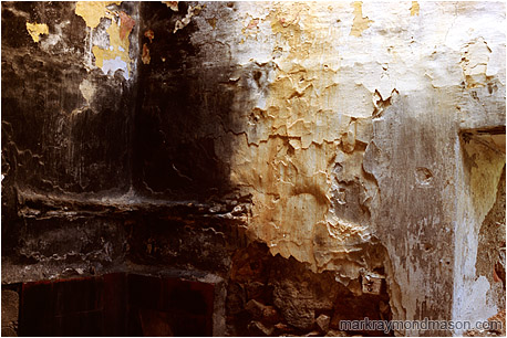 Abstract photo of singed plaster and wood in an abandoned house