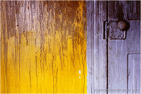 Abstract photograph of stained water streams on the colourful interior of a burned-out house