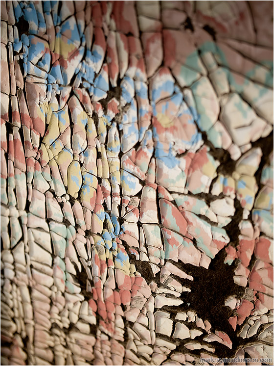 Crumbled Paint, Voids: Kamloops, BC, Canada (2011-03-06) - Abstract macro photograph showing crumbled paint and shadows on the side of an old woodshed