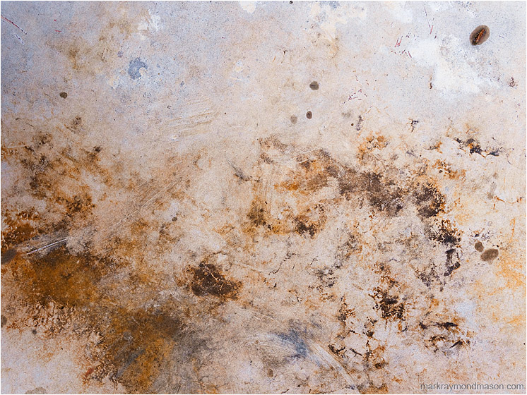 Stained Tabletop: Near Kamloops, BC, Canada (2012-03-08) - Abstract photograph showing stormy-looking stains on the surface of a plastic picnic table