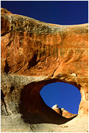 Arch, Sandstone Mountain: Arches, UT, USA (2003) - Abstract photograph of sculpted sandstone mountains, arches and shadows