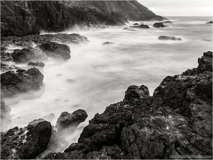 Steep Bay, Smokey Sea: Near Stawberry Hill Park, OR, USA (2015-10-21) - Fine art black and white long exposure photograph of waves crashing on a rugged bay