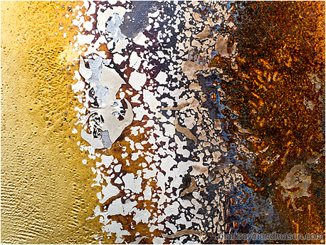 Abstract photo of progression and evolution in chipped paint patterns, from plain fibre to complex lava-like rust