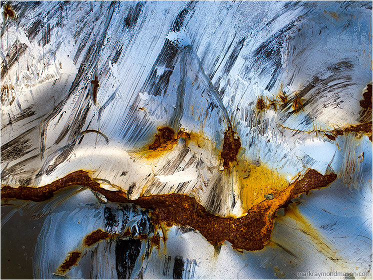 Creased Metal, Snowy Landcape: Near Waimea, HI, USA (2016-02-02) - Abstract photograph showing painted metal, kinked and rusted, looking like the peak of a volcano covered in snow