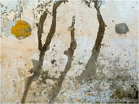 Abstract photograph showing patterns on a wall of an abandoned building, resembling Japanese brushstroke artwork